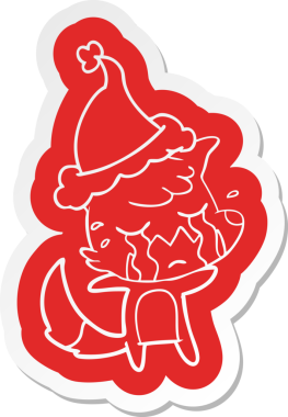 Ağlayan tilki çizgi film çıkartması. Bir insan tarafından çizilmiş Noel Baba şapkası.