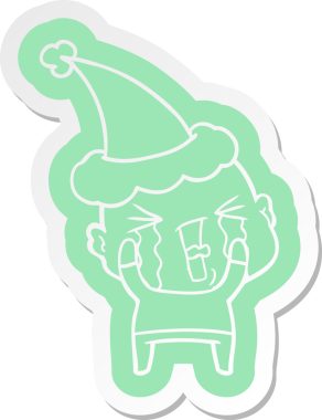 Bir insan tarafından çizilmiş Noel Baba şapkası giyen ağlayan kel bir adamın garip çizgi film etiketi.