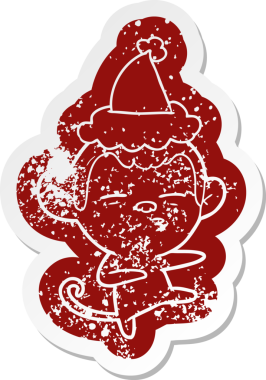 Bir insan tarafından çizilmiş Noel Baba şapkası giyen şüpheli bir maymunun garip bir karikatürü.