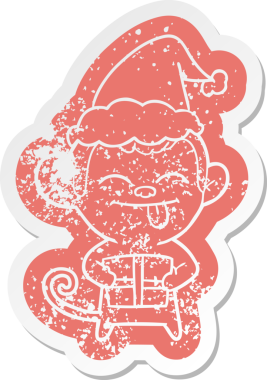 Komik çizgi film Noel hediyesi olan bir maymunun insan tarafından çizilmiş Noel Baba şapkasıyla kederli çıkartması.