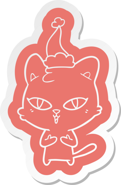 Bir insan tarafından çizilmiş Noel Baba şapkası takan bir kedinin garip karikatür çıkartması.