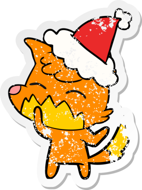 Bir insan tarafından çizilmiş Noel Baba şapkası giymiş tilki resmi.