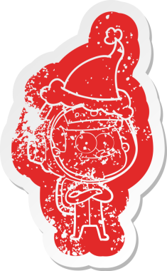 Mutlu astronot çizgi filmi, insan tarafından çizilmiş Noel Baba şapkasının çıkartması.