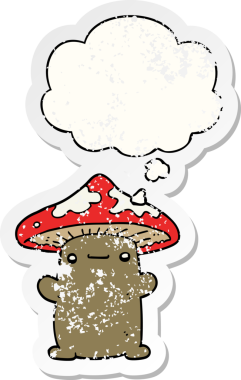 Düşünce baloncuğu olan karikatür mantarı insan tarafından çizilmiş yıpranmış bir çıkartma.