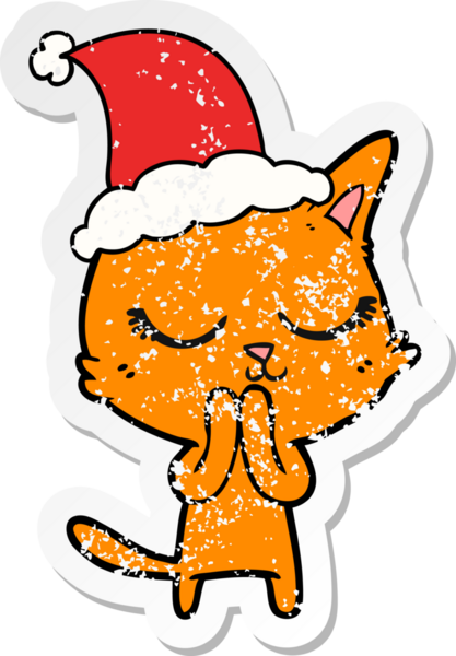 Sakin bir el, kederli bir insan tarafından çizilmiş Noel Baba şapkası takan bir kedinin çıkartması.