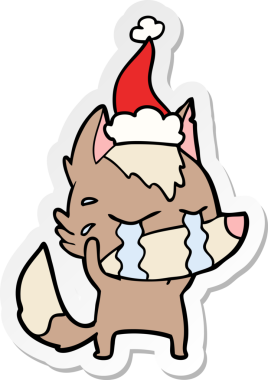 Ağlayan bir kurdun insan tarafından çizilmiş Noel Baba şapkası taktığı el yazısı.