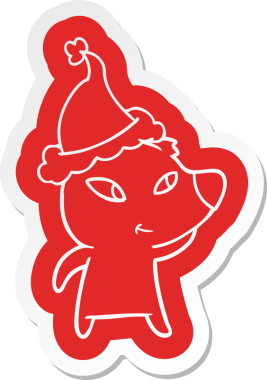 Bir insan tarafından çizilmiş Noel Baba şapkası giyen bir ayının komik çizgi film çıkartması.