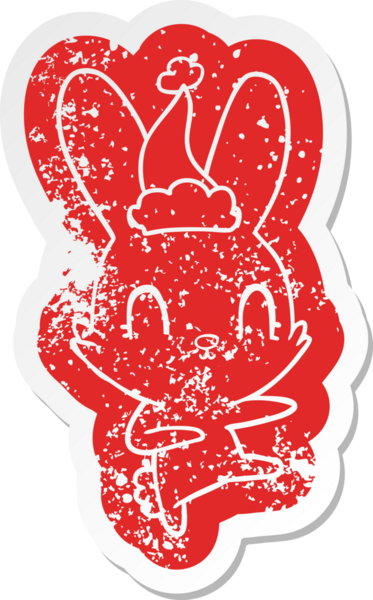 Sevimli, tuhaf çizgi film. Bir insan tarafından çizilmiş Noel Baba şapkası takan tavşan çıkartması.