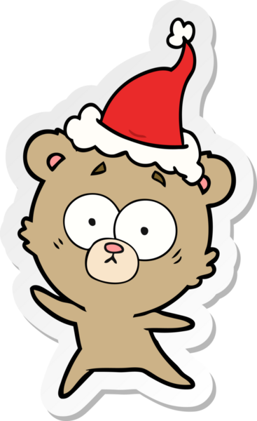Endişeli ayı eli bir insan tarafından çizilmiş Noel Baba şapkasının çıkartması.
