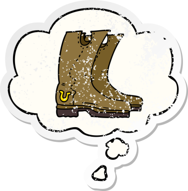 Düşünce baloncuklu çizgi kovboy çizmeleri bir insan tarafından çizilmiş yıpranmış bir çıkartma.