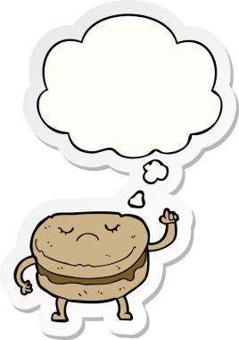 Düşünce baloncuklu çizgi film bisküvisi insan tarafından çizilmiş bir çıkartma.