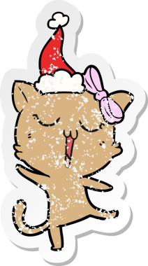 Bir insan tarafından çizilmiş Noel Baba şapkası takan bir kedinin çizilmiş el yazısı.