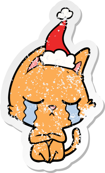 Ağlayan el, bir insan tarafından çizilmiş Noel Baba şapkası giymiş bir kedinin kederli çıkartması.