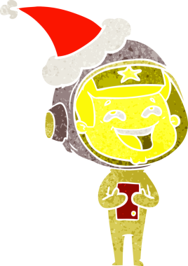 Bir insan tarafından çizilmiş Noel Baba şapkası giymiş gülen bir astronotun el çizimi.