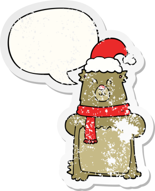 Karikatür ayısı Noel şapkası takıyor ve konuşma baloncuğu takıyor. Bir insan tarafından çizilmiş sıkıntılı eski bir çıkartma.