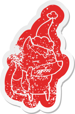 Garip çizgi film, bir insanın çizdiği Noel Baba şapkasını takan dişlerini gösteren bir kurt çıkartması.