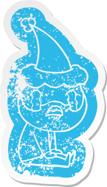 Garip bir çizgi film. Ağlayan sakallı bir adamın çıkartması. Noel Baba şapkası takıyor.