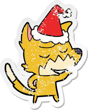 Bir insan tarafından çizilmiş Noel Baba şapkası takan bir tilki çizilmiş.