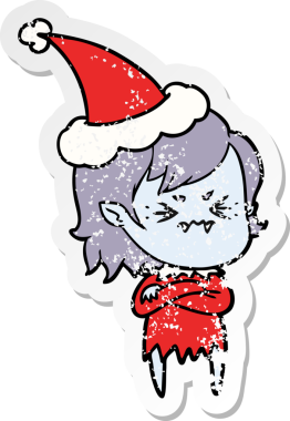 Bir insan tarafından çizilmiş Noel Baba şapkası takan vampir bir kızın gergin bir şekilde çizilmiş çıkartması.