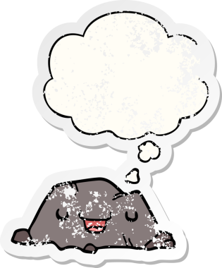 Düşünce baloncuğu olan karikatür taşı, insan tarafından çizilmiş yıpranmış bir çıkartma gibi.