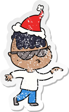 Bir insanın çizdiği Noel Baba şapkasını takan, güneş gözlüğü takan bir çocuğun çizilmiş el yazısı.