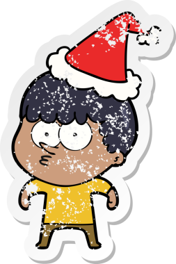 Bir insan tarafından çizilmiş Noel Baba şapkası giymiş meraklı bir çocuğun el çizimi karikatürü.