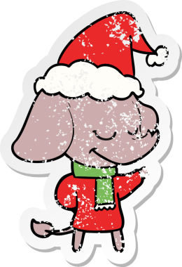 Bir insan tarafından çizilmiş Noel Baba şapkası takan gülümseyen bir filin el yazısı.