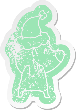 Gülen kutup ayısı çizgi filmi, bir insan tarafından çizilmiş Noel Baba şapkasının çıkartması.