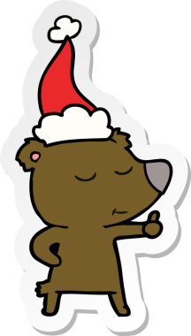 Bir insanın çizdiği Noel Baba şapkasını takan bir ayının mutlu el çizimi karikatürü.