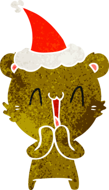 Mutlu ayı eli bir insan tarafından çizilmiş Noel Baba şapkasının retro çizimi.