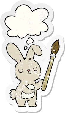 Düşünce balonlu boya fırçası olan çizgi film tavşanı insan tarafından çizilmiş yıpranmış bir çıkartma.