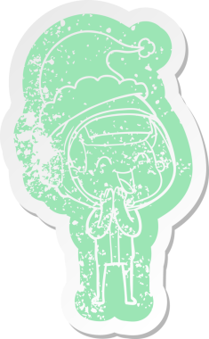 Mutlu çizgi film, bir insan tarafından çizilmiş Noel Baba şapkası giyen bir astronotun sıkıntılı çıkartması.