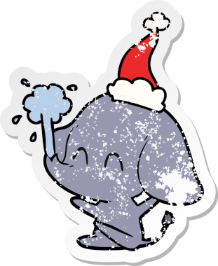 Sevimli el, insan tarafından çizilmiş Noel Baba şapkasıyla su püskürten bir fil çıkartması çizmiş.