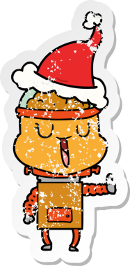 Bir insan tarafından çizilmiş Noel Baba şapkası takan bir robotun çizilmiş mutlu el yazısı.