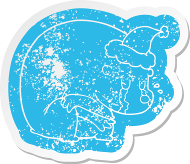 Ağlayan karikatür. Bir insan tarafından çizilmiş Noel Baba şapkası takan kutup ayısının sıkıntılı çıkartması.