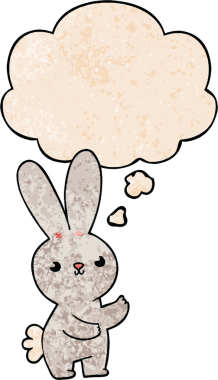 Bir insan tarafından çizilmiş grunge desenli düşünce baloncuklu şirin çizgi film tavşanı.