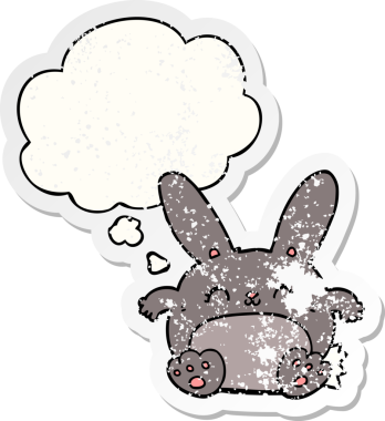 Düşünce baloncuğu olan çizgi film tavşanı insan tarafından çizilmiş yıpranmış bir çıkartma.