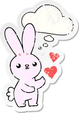Düşünce baloncuklu aşk dolu sevimli çizgi film tavşanı insan tarafından çizilmiş yıpranmış bir çıkartma gibi.