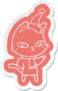 Bir insan tarafından çizilmiş Noel Baba şapkası takan bir kedinin garip çizgi film çıkartması.