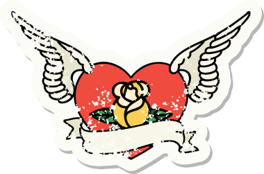 Geleneksel bir stil olan, çiçek ve pankart çizilmiş uçan kalp dövmesi.