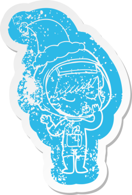 Bir insan tarafından çizilmiş Noel Baba şapkası giyen güzel bir astronot kızın garip bir karikatürü.