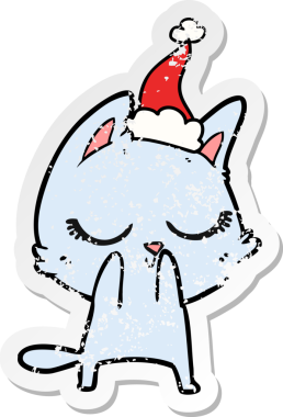 Sakin bir el, kederli bir insan tarafından çizilmiş Noel Baba şapkası takan bir kedinin çıkartması.