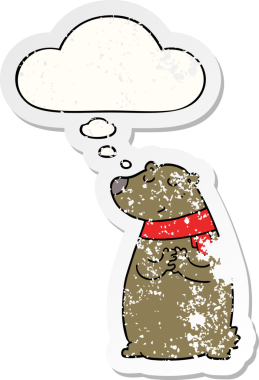 Düşünce baloncuklu bir eşarp takan çizgi film ayısı bir insan tarafından çizilmiş yıpranmış bir çıkartma gibi