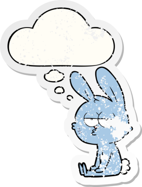 Düşünce baloncuğu olan sevimli çizgi film tavşanı bir insan tarafından çizilmiş yıpranmış bir çıkartma.