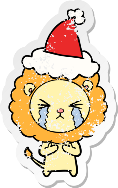 Bir insan tarafından çizilmiş Noel Baba şapkası giymiş ağlayan bir aslanın el yazısı.