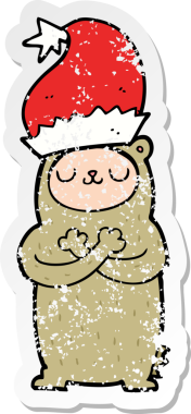 Bir insan tarafından çizilmiş Noel şapkası giyen bir ayının sıkıntılı çıkartması.