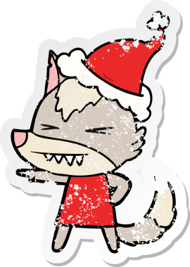 Kızgın kurt eli, bir insan tarafından çizilmiş Noel Baba şapkasının üzgün çıkartmasını çizmiş.