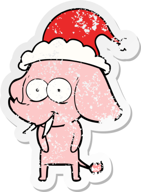 Mutlu el, bir insan tarafından çizilmiş Noel Baba şapkası takan bir fil çıkartması çizmiş.