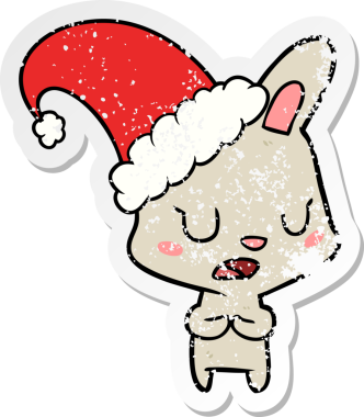 Bir insan tarafından çizilmiş Noel şapkası takan bir tavşanın sıkıntılı çıkartması.