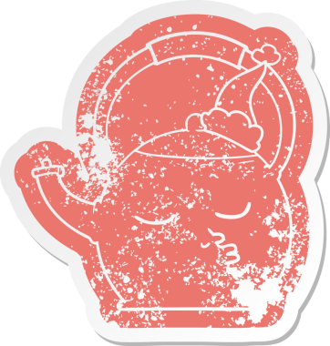 Bir insan tarafından çizilmiş Noel Baba şapkası giyen bir çaydanlığın sıkıntılı çıkartması.